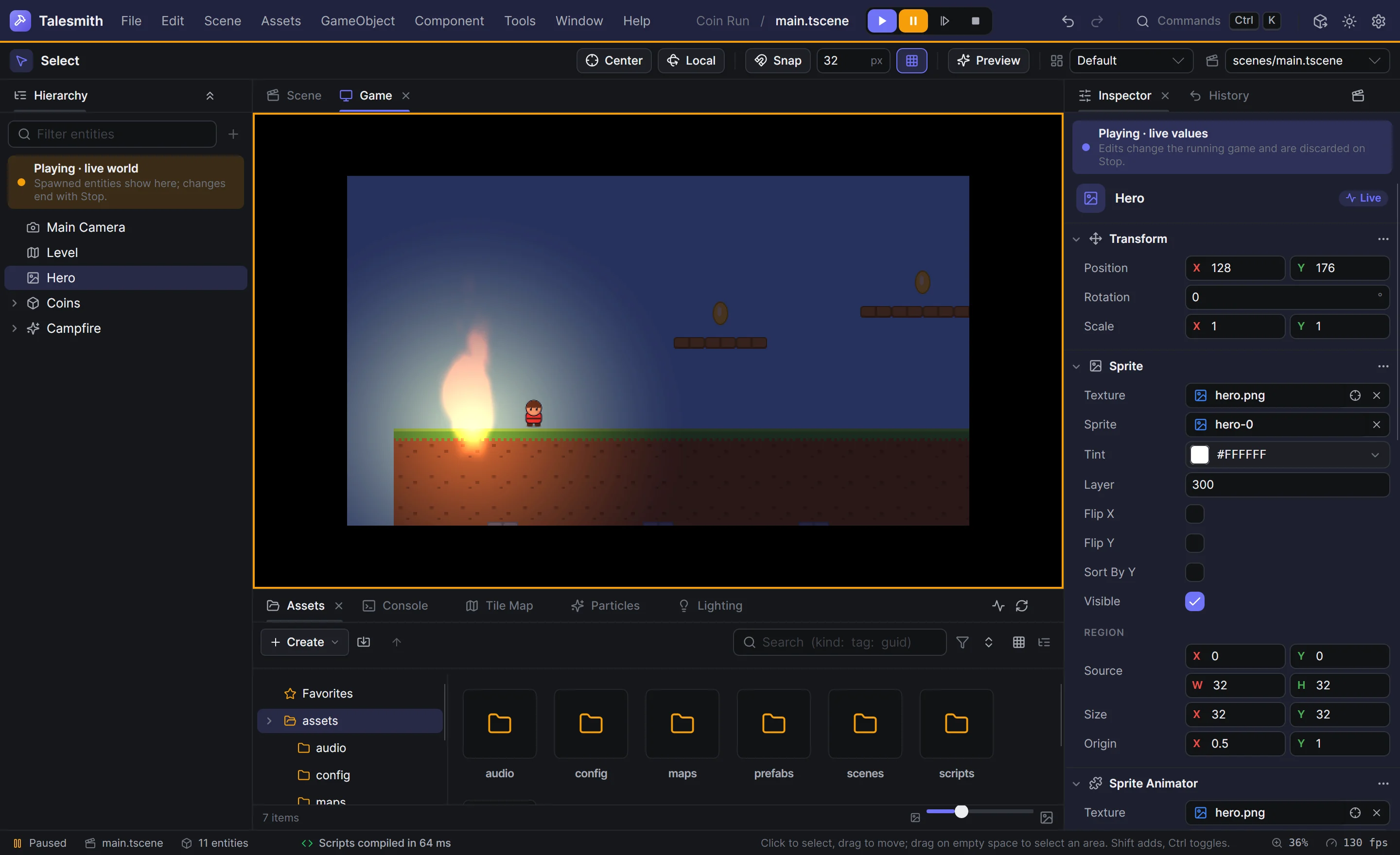 Play mode paused: the app bar's strip and the Game panel's frame in amber, the hero's live values in the inspector